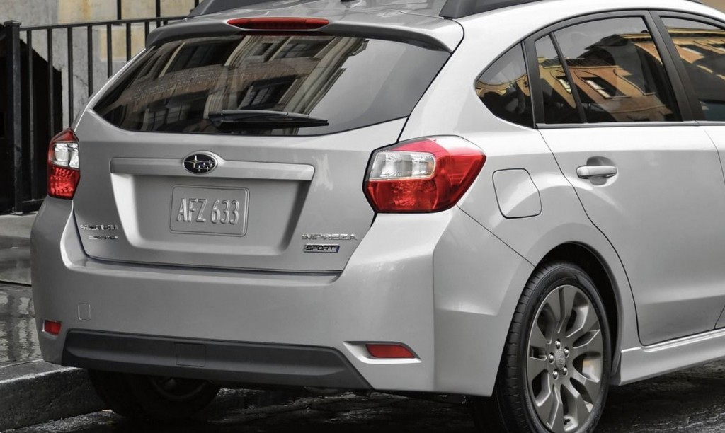 The rear end of a silver 2013 Subaru Impreza hatchback