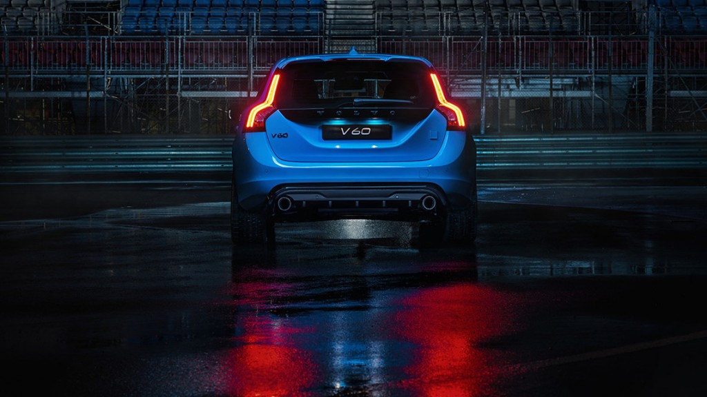 The rear end of a blue Volvo V60 Polestar